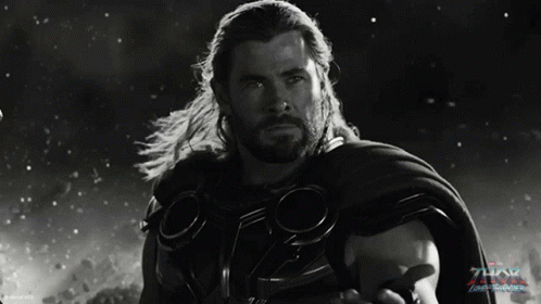 A Black And White Photo Of Thor With The Word Thor On The Bottom Right GIF