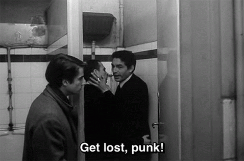 A Black And White Photo Of Three Men Standing In A Bathroom With The Caption Get Lost Punk GIF