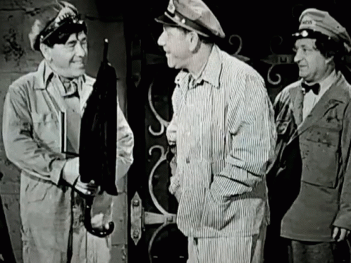A Black And White Photo Of Three Men With One Wearing A Hat That Says " Army " GIF