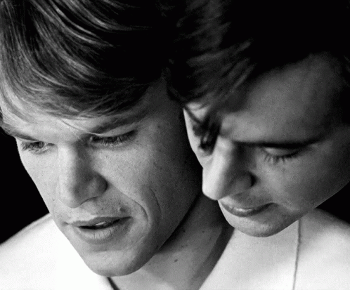 A Black And White Photo Of Two Men 'S Faces With Their Eyes Closed GIF