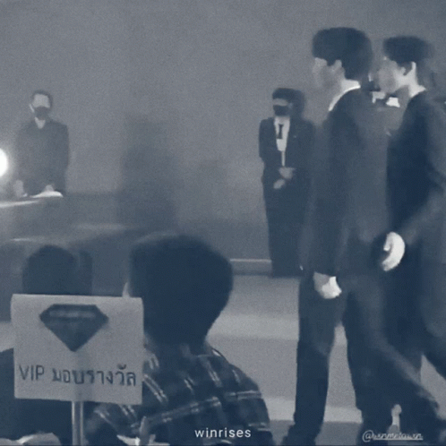 A Black And White Photo Of Two Men Standing Next To Each Other With The Words Winrises On The Bottom GIF