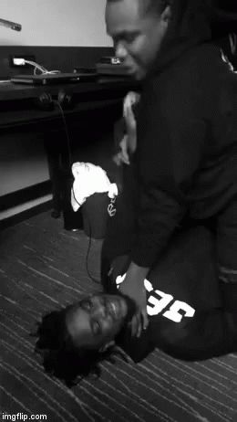 A Black And White Photo Of Two Men With One Wearing A Sweatshirt That Says Efc GIF
