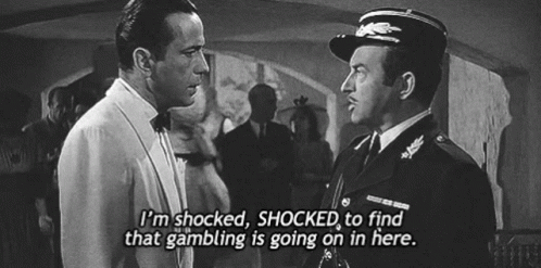 a black and white photo of two men with the caption i 'm shocked shocked to find that gambling is going on