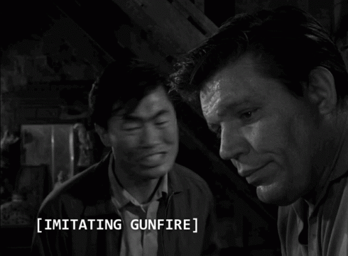 A Black And White Photo Of Two Men With The Caption Imitating Gunfire On The Bottom GIF