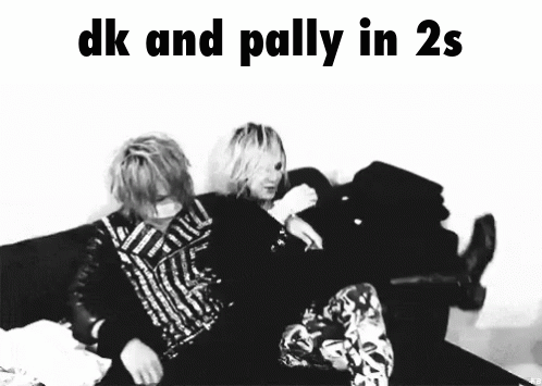 A Black And White Photo Of Two People Sitting On A Couch With The Caption " Dk And Palliy In 2S " GIF