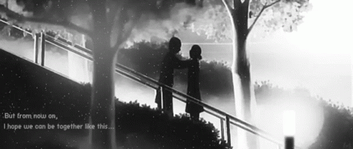 a black and white photo of two people standing on a bridge with the words " i am now on "
