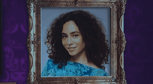 a black and white portrait of a woman with curly hair