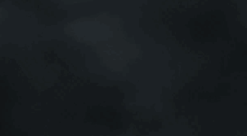 A Black Background With A Blurred Image Of A Cloudy Sky . GIF
