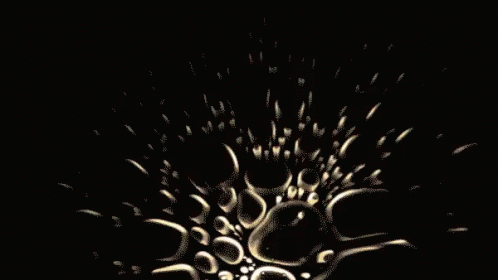 A Black Background With A Circle Of Bubbles In The Middle GIF