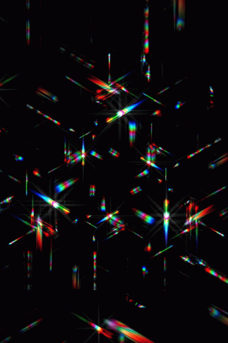 A Black Background With A Lot Of Lines That Are Glowing In The Dark GIF