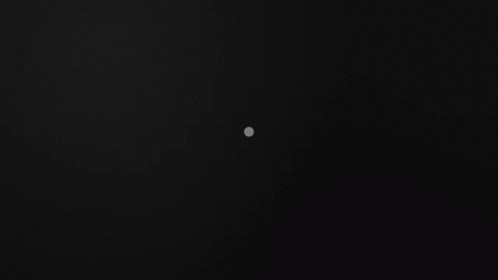 A Black Background With A Triangle And Two Dots GIF