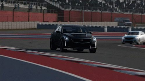 A Black Cadillac Is Driving On A Track GIF