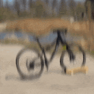 A Black Cannondale Bicycle Is Parked On The Side Of A Road GIF