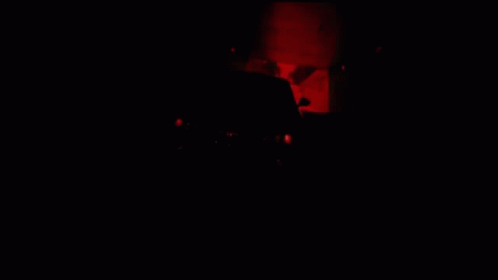 A Black Car Is Driving Down A Highway GIF
