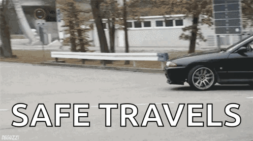 A Black Car Is Driving Down A Street With The Words Safe Travels Written On The Bottom GIF