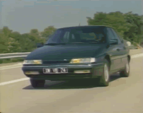 A Black Car With A License Plate That Says Dx 15 24 GIF