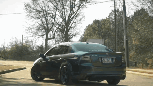 A Black Car With A License Plate That Says Pzl - Xm - A On It GIF
