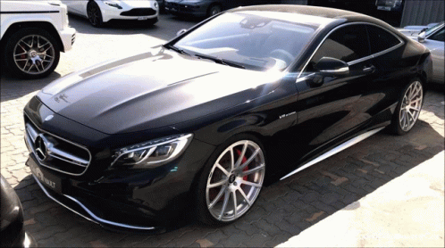A Black Car With A License Plate That Says Renault On It GIF