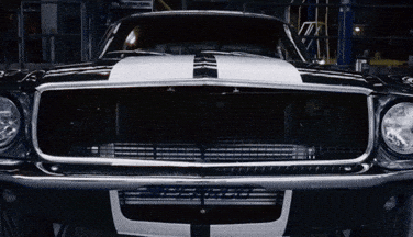 a black car with a white stripe on the hood