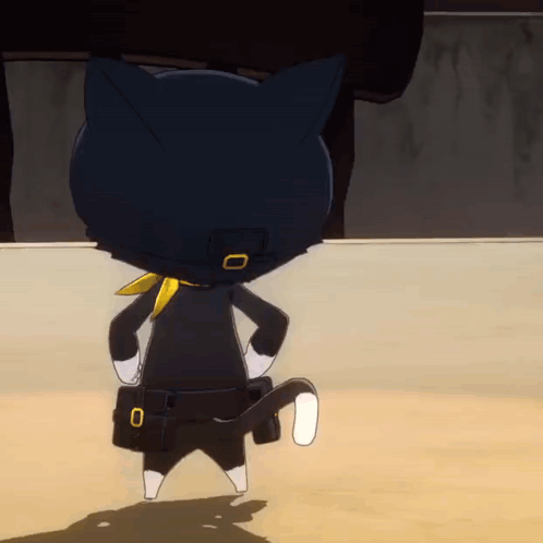 A Black Cat With A Yellow Scarf Around Its Neck Is Standing On A Sandy Surface GIF