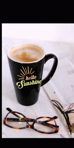 A Black Coffee Mug That Says Hello Sunshine On It GIF