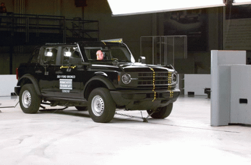 A Black Ford Bronco Is Being Tested In A Building GIF