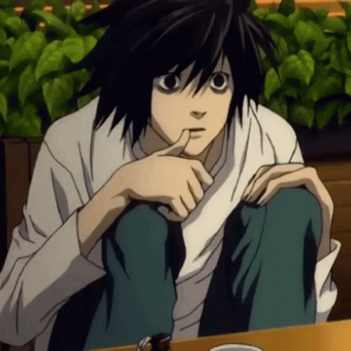 A Black Haired Anime Character Sitting At A Table With His Hand On His Chin GIF