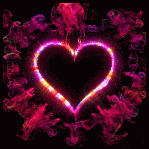 A Black Heart Is Surrounded By A Rainbow Colored Smoke Ring GIF