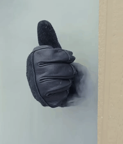 A Black Leather Glove Is Giving A Thumbs Up GIF