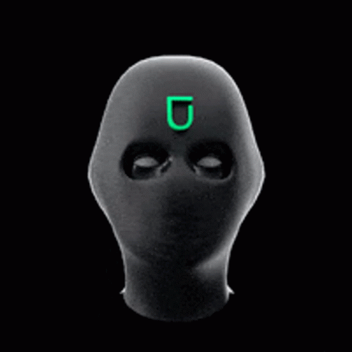 A Black Mask With A Green Letter U On It GIF