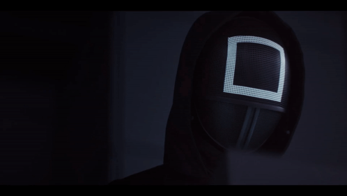 A Black Mask With A White Square On It GIF