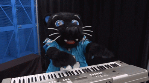 A Black Panther Mascot Playing A Keyboard With A Blue Shirt On GIF