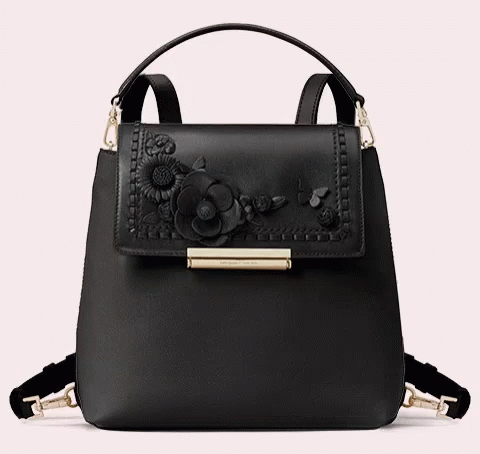 A Black Purse With Flowers On It And The Word Kate Spade On The Front GIF