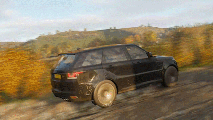 A Black Range Rover Is Driving On A Dirt Road . GIF