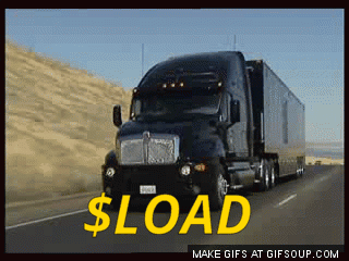 A Black Semi Truck Is Driving Down A Highway With The Words $ Load In Yellow GIF
