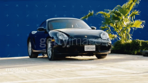 A Black Sports Car With A California License Plate That Says 2681564 GIF
