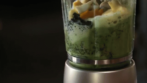 A Blender Is Filled With A Green Smoothie GIF