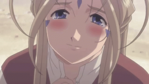 A Blonde Anime Girl With Blue Eyes Is Crying With Her Eyes Closed GIF