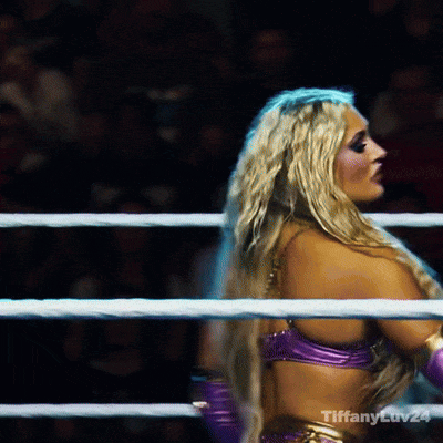A Blonde Woman In A Purple Top Is In A Boxing Ring With Tiffany Ev24 Written On The Bottom Right GIF