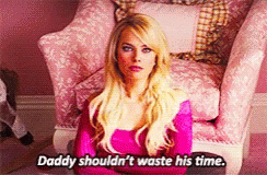 A Blonde Woman Is Sitting In A Pink Chair And Says Daddy Shouldn 'T Waste His Time GIF