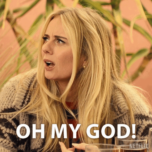 A Blonde Woman Says Oh My God While Holding A Glass Of Wine GIF