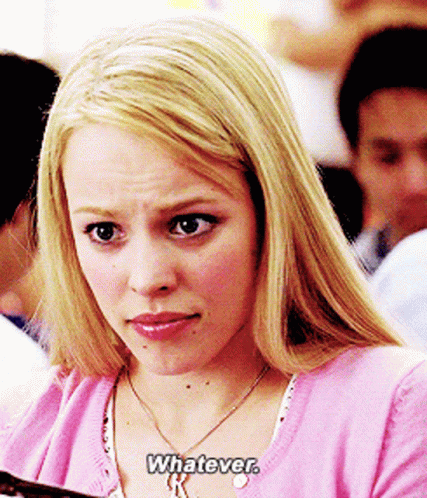 A Blonde Woman Wearing A Pink Sweater And Necklace Says Whatever GIF