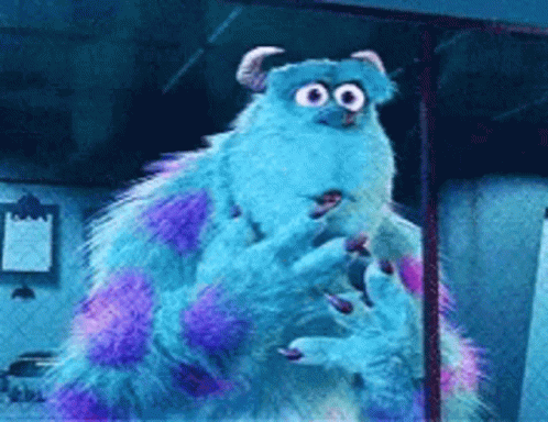 A Blue And Purple Monster From Monsters Inc Is Standing In A Room GIF