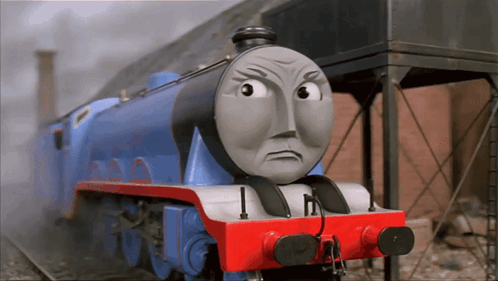 A Blue And Red Train With A Face That Says I On It GIF