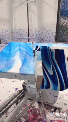 A Blue And White Painting Is Being Painted On A Table With A Tik Tok Watermark GIF
