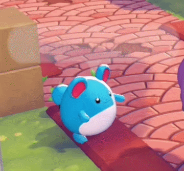 A Blue And White Stuffed Animal Is Sitting On A Bench With A Speech Bubble That Says " Nom Nom Nom " GIF