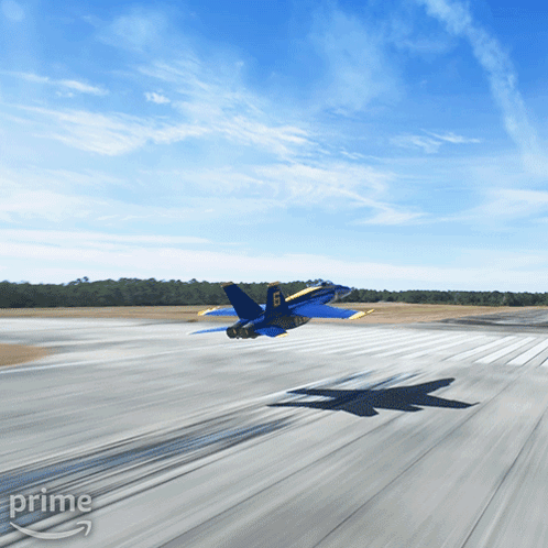 A Blue And Yellow Fighter Jet Is Taking Off From A Runway With The Word Prime On The Bottom Right GIF