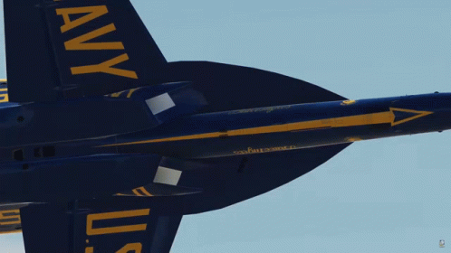 A Blue And Yellow Fighter Jet With The Letters Uss On The Tail GIF