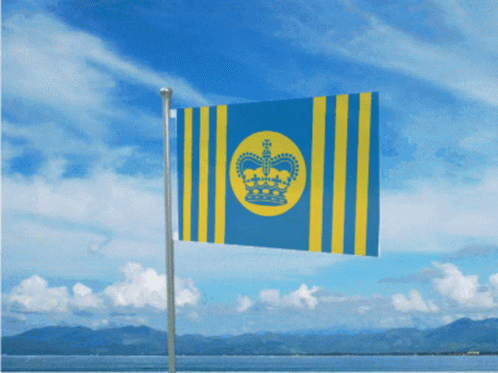 A Blue And Yellow Flag That Says ' Hawaii ' On It Is Flying In The Wind GIF