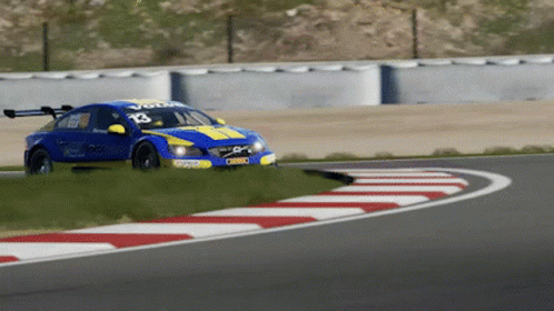 A Blue And Yellow Racing Car With The Number 13 On It GIF